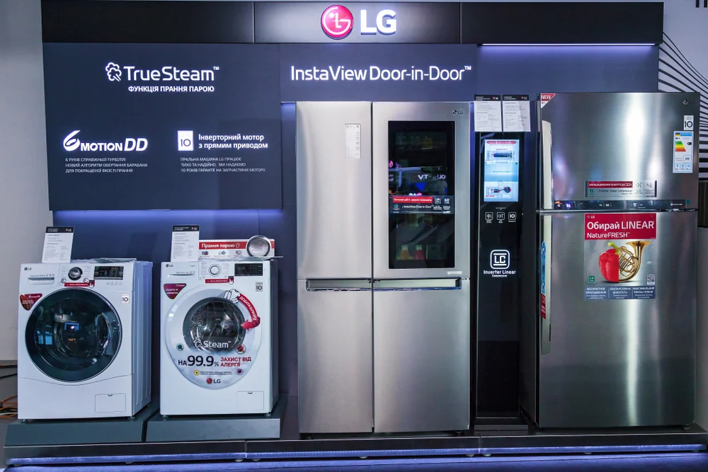 LG fridge, washer, and dryer on display.