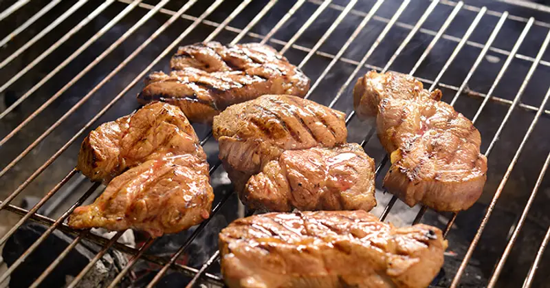 Meat pieces on a grill