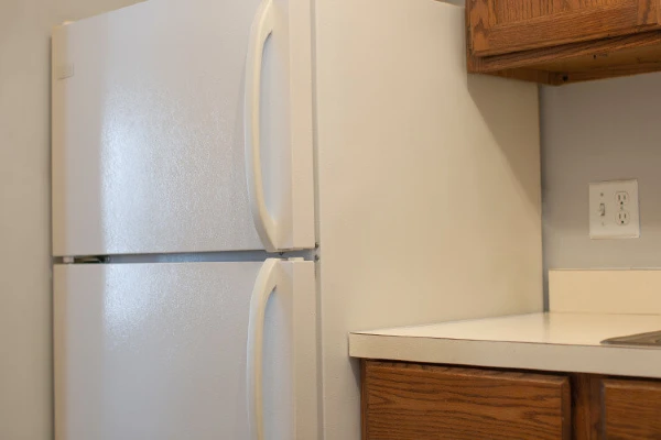 A white refrigerator in a kitchen