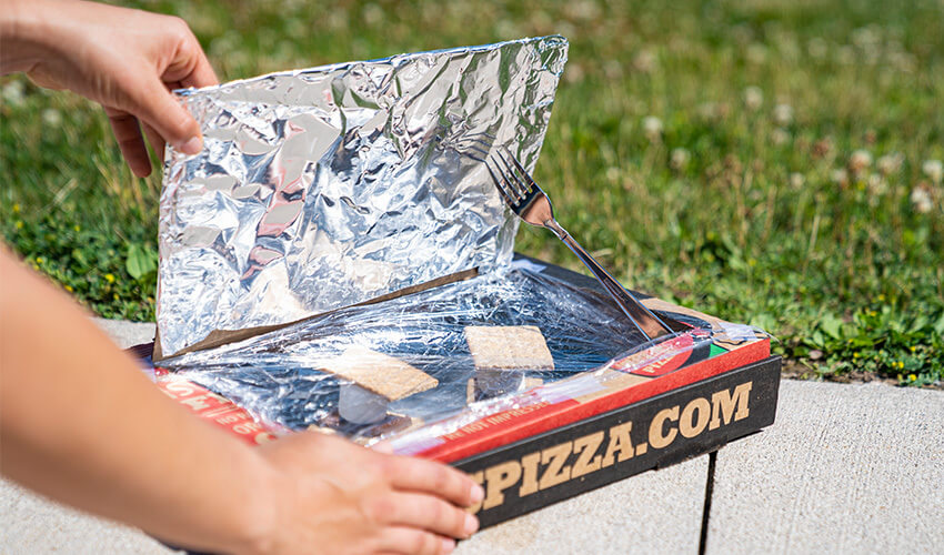 Solar oven with fork and aluminium foil