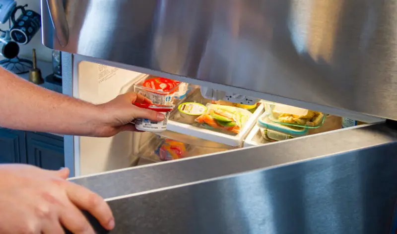 Taking food from a working refrigerator